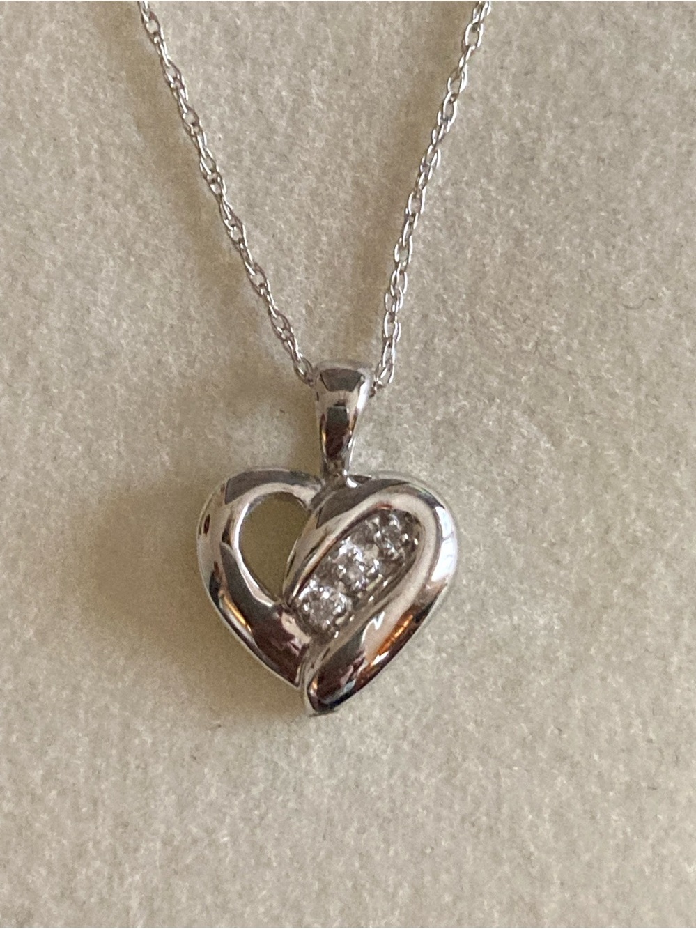 10K Gold Heart Chain with 3 diamonds. Signed.